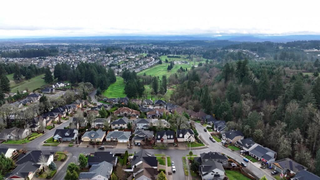 Oregon roofing guide showing Willamette Valley neighborhood with residential roofs and moss-prone environment