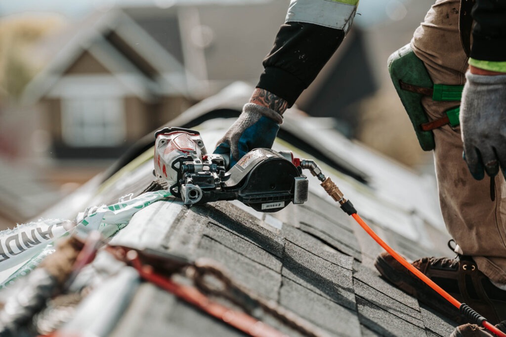 Oregon Roofing Guide for Homeowners Moss Boss Roofing Salem Oregon Roofer installing asphalt shingles on an Oregon home as part of a residential roofing project.